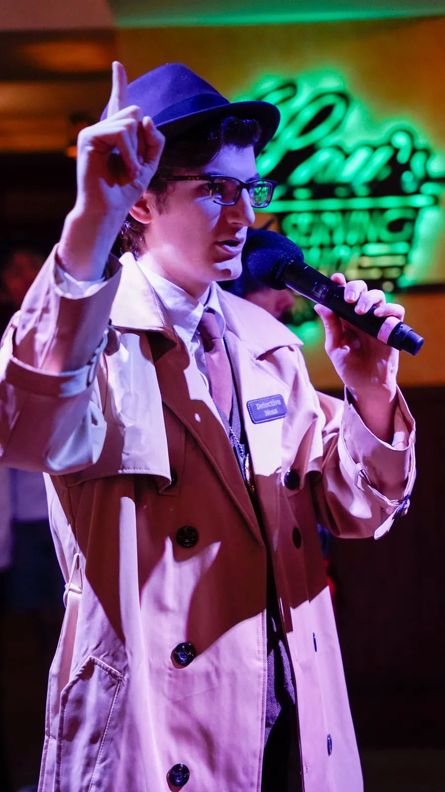 A Murder Mystery Company actor working the room at a Newark show